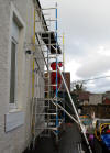The Husband building the scaffolding