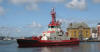 a tug boat and The Old Toll House Stavanger Harbour