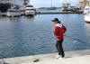 a man fishing in Stavanger Harbour
